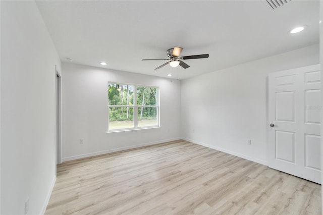 unfurnished room featuring light hardwood / wood-style floors and ceiling fan