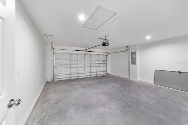 garage featuring a garage door opener and electric panel