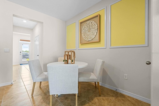 dining area featuring tile patterned flooring