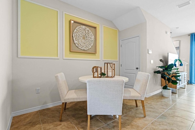 dining area with tile patterned flooring