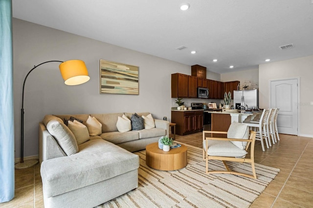 living room with light tile patterned floors