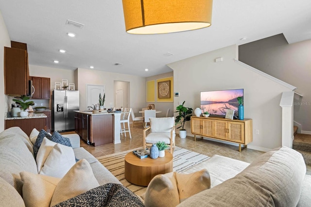 living room with light tile patterned floors