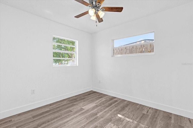 unfurnished room with ceiling fan and light hardwood / wood-style flooring