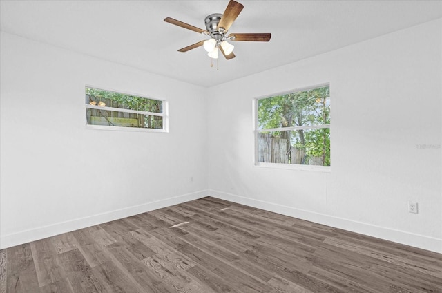 unfurnished room featuring ceiling fan and dark hardwood / wood-style floors