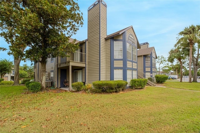 view of property exterior with a yard