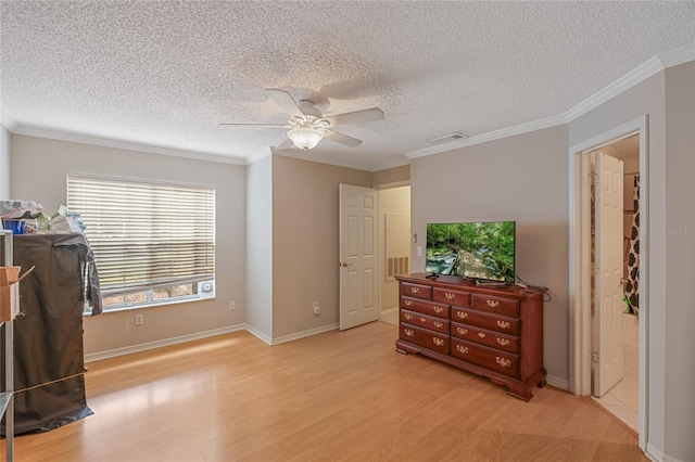 bedroom featuring a textured ceiling, light hardwood / wood-style floors, ceiling fan, and crown molding