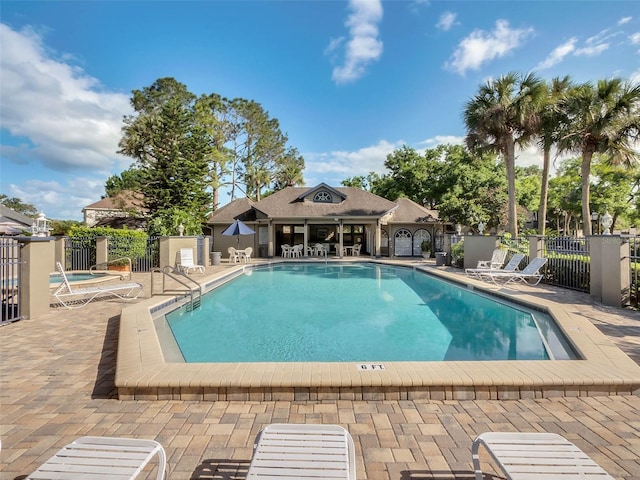 view of swimming pool with a patio