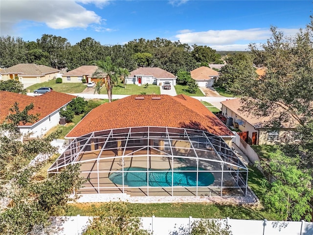 view of swimming pool with a patio and a lanai