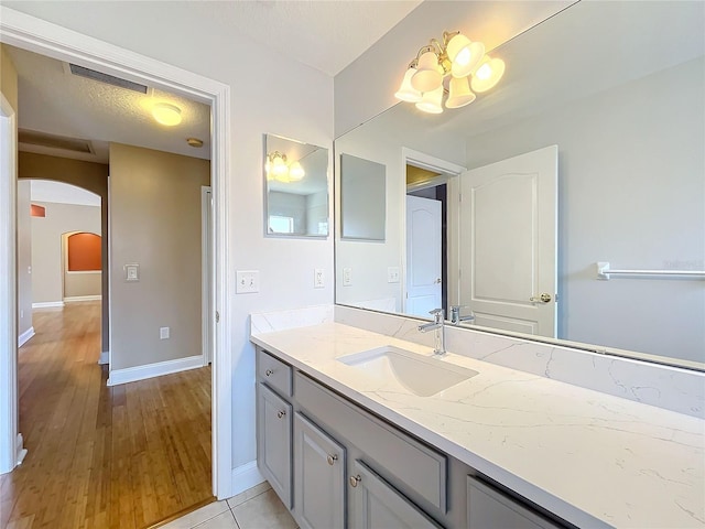 bathroom with vanity and wood-type flooring