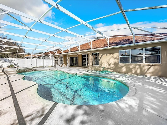 view of pool with a patio and a lanai