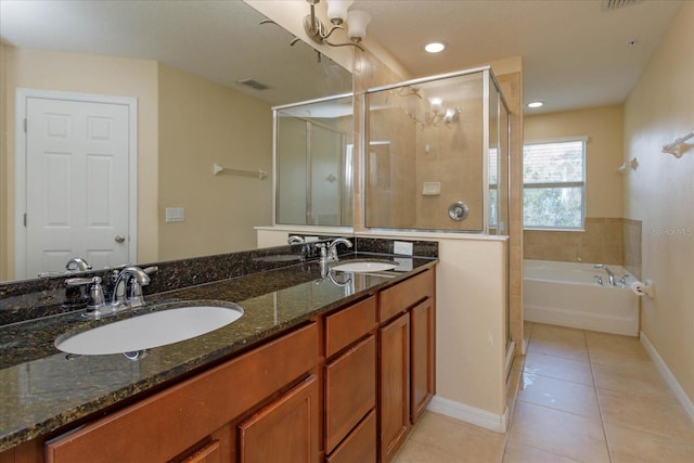 bathroom featuring vanity, shower with separate bathtub, and tile patterned flooring