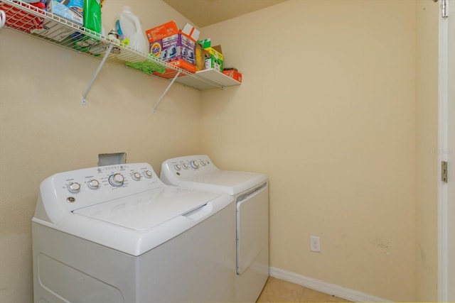 washroom featuring washing machine and dryer