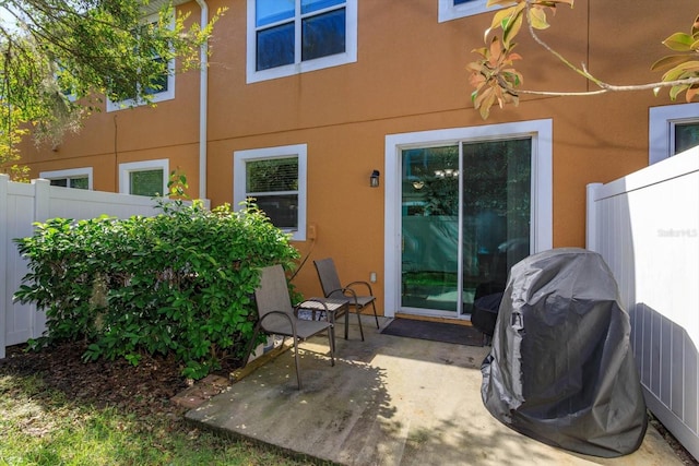 back of house with a patio