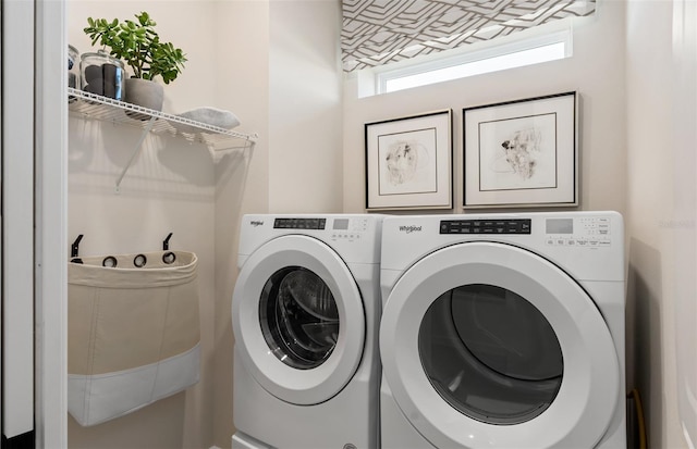 laundry area with washing machine and dryer