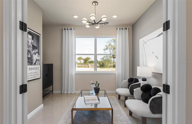 sitting room with an inviting chandelier and light tile patterned flooring