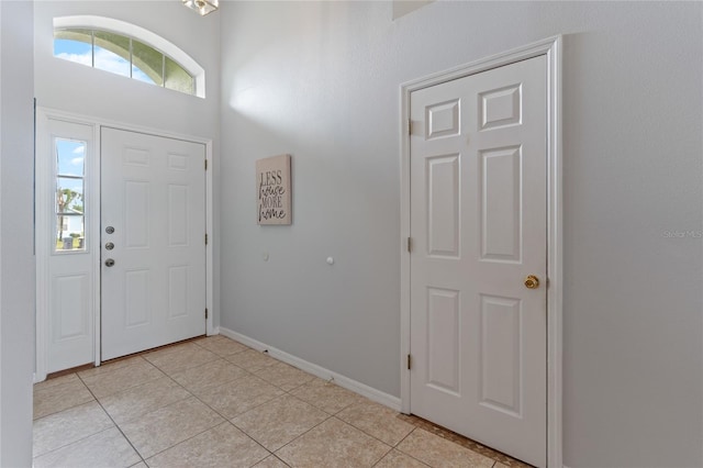 entryway with light tile patterned floors