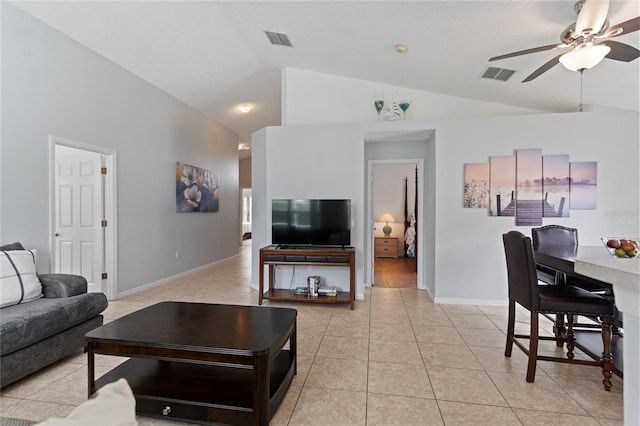 tiled living room with lofted ceiling and ceiling fan