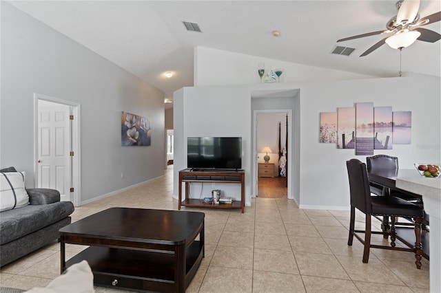 246 Kimberly Point Dr, Davenport, FL 33837 - living room featuring lofted ceiling, a ceiling fan, light tile patterned floors, and baseboards