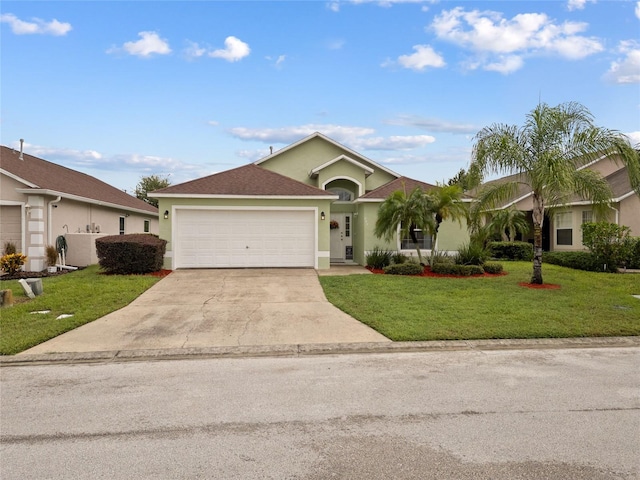 246 Kimberly Point Dr, Davenport, FL 33837 - single story home featuring stucco siding, an attached garage, concrete driveway, and a front yard