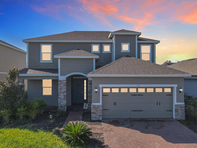 view of front of property featuring a garage