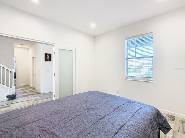 bedroom with light hardwood / wood-style flooring