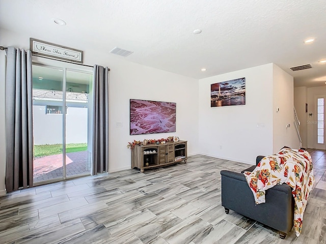 living room with light hardwood / wood-style flooring