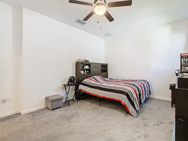 bedroom with ceiling fan and light colored carpet