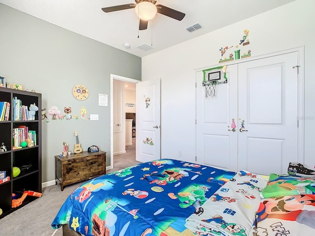 bedroom featuring carpet flooring, ceiling fan, and a closet