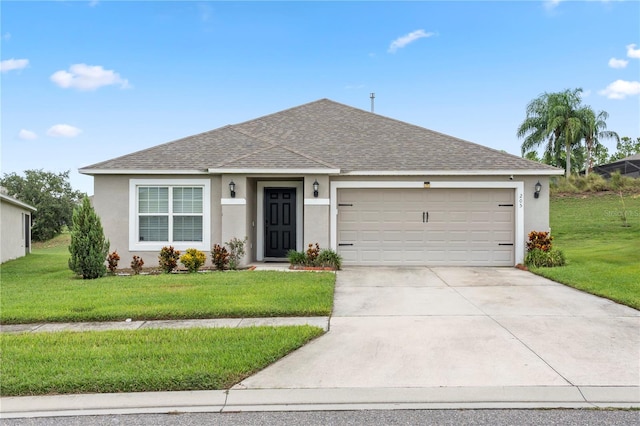 ranch-style home featuring a garage and a front lawn