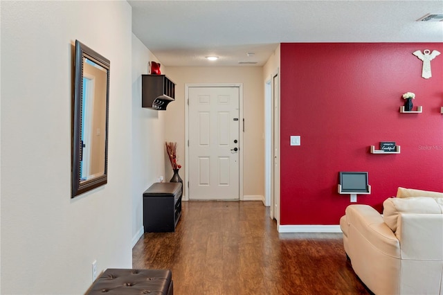 entryway with dark wood-type flooring