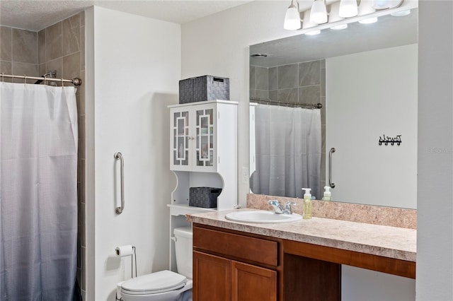 bathroom with a shower with curtain, vanity, toilet, and a textured ceiling