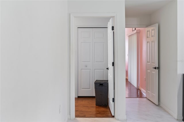 hallway with light wood-type flooring