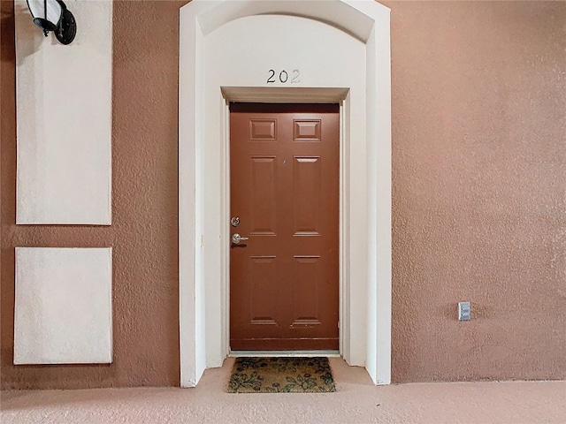 8298 Portofino Dr Unit 202, Davenport, FL 33896 - doorway to property featuring stucco siding