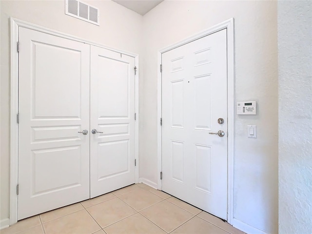 8298 Portofino Dr Unit 202, Davenport, FL 33896 - foyer with light tile patterned floors