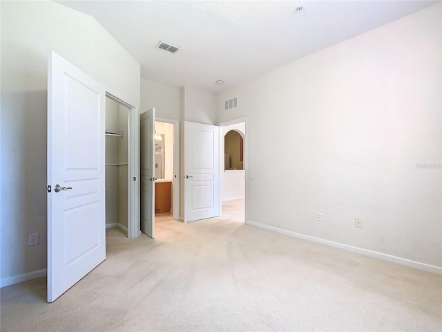 8298 Portofino Dr Unit 202, Davenport, FL 33896 - unfurnished bedroom with light colored carpet, a closet, and baseboards