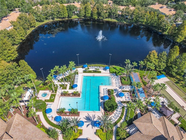 birds eye view of property with a water view