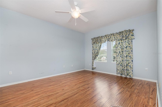 empty room featuring hardwood / wood-style floors and ceiling fan