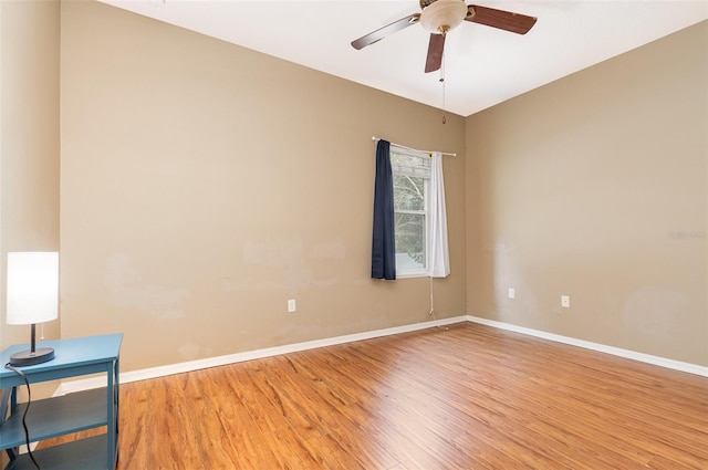 spare room featuring ceiling fan and light hardwood / wood-style flooring