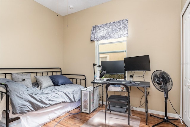 bedroom featuring wood-type flooring