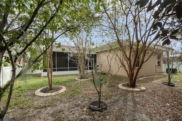 rear view of house with a sunroom