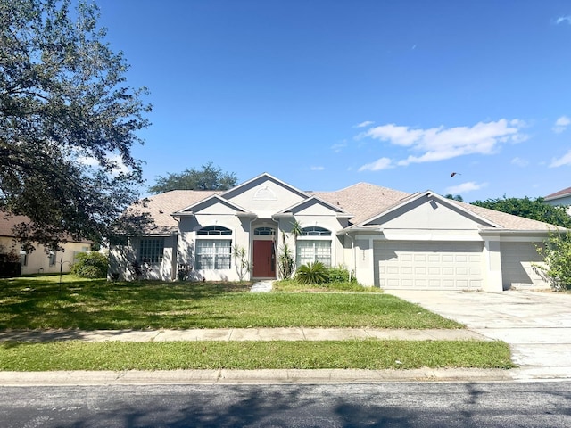 view of front of house featuring a garage and a front yard