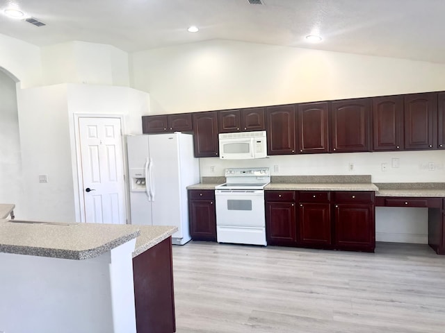 kitchen with white appliances, light hardwood / wood-style floors, and high vaulted ceiling