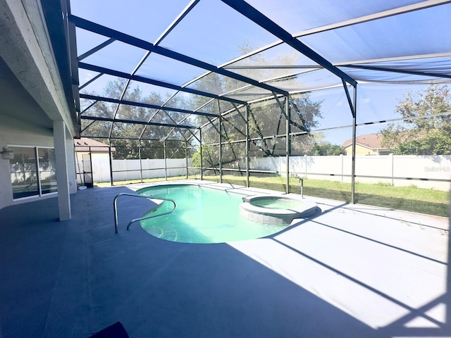 view of pool with a lanai, an in ground hot tub, and a patio