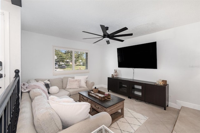 living room with light tile patterned floors, a textured ceiling, and ceiling fan