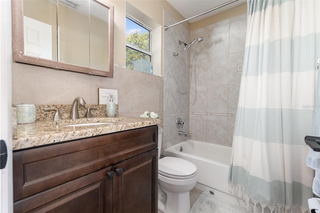 full bathroom featuring decorative backsplash, shower / tub combo, vanity, and toilet