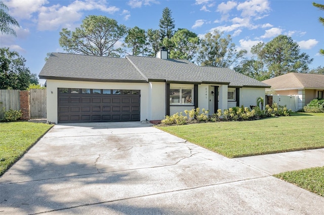 ranch-style home with a front yard and a garage