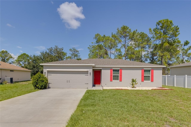 ranch-style house featuring central AC unit, a garage, and a front lawn