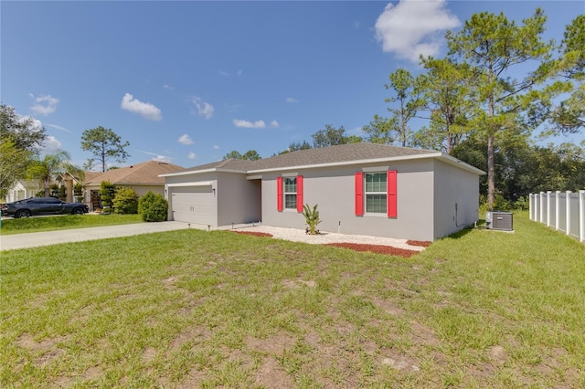 ranch-style house with central air condition unit, a garage, and a front yard