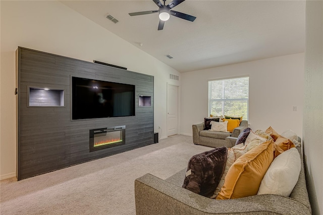 living room featuring ceiling fan, vaulted ceiling, and light colored carpet