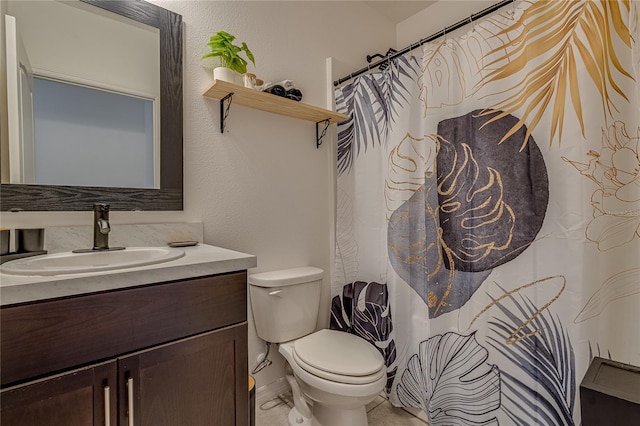 bathroom with vanity, toilet, and a shower with shower curtain